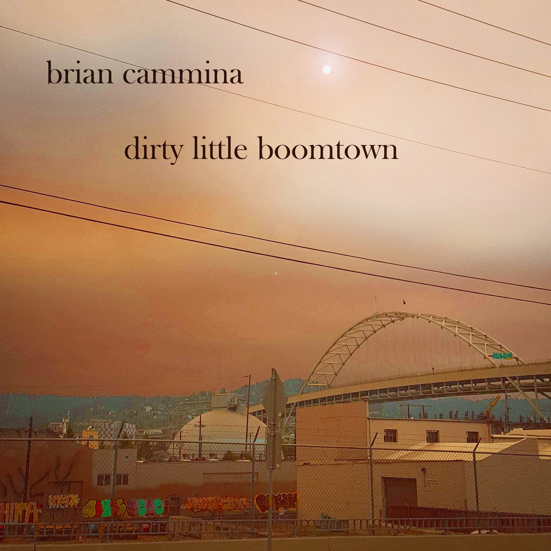 dirty little boomtown album cover: Portland beneath a warm, hazy sky